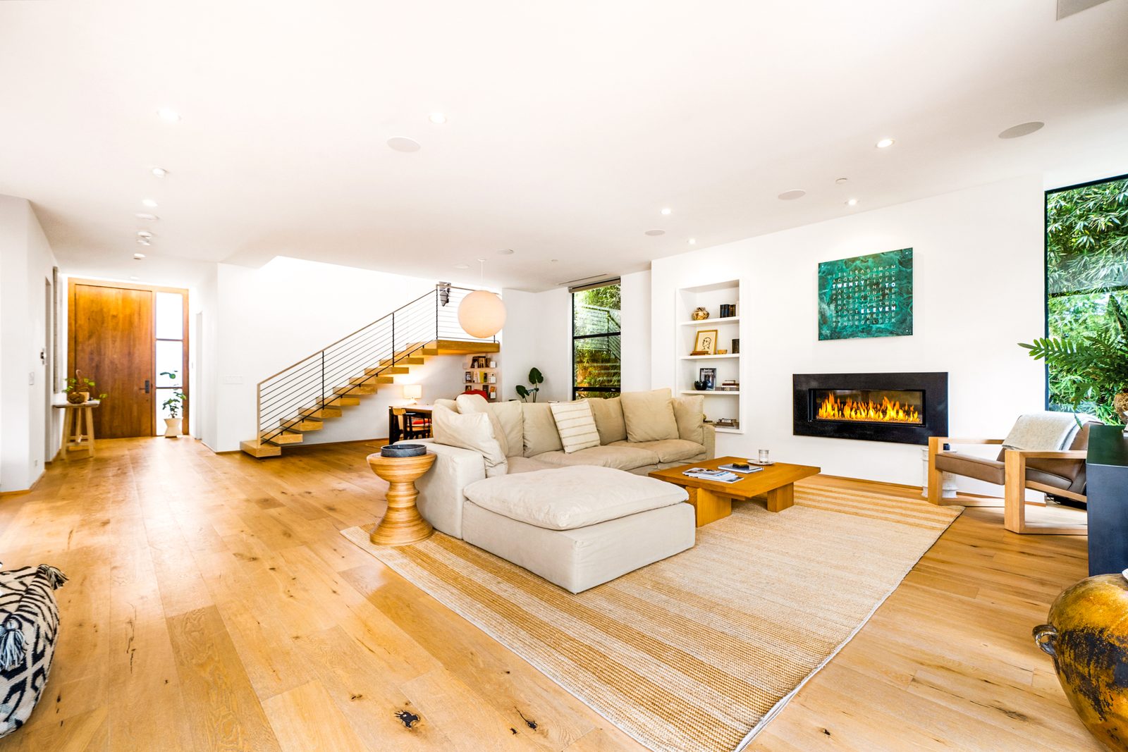 Professional HDR real estate photo of an Orange County living room with balanced window light