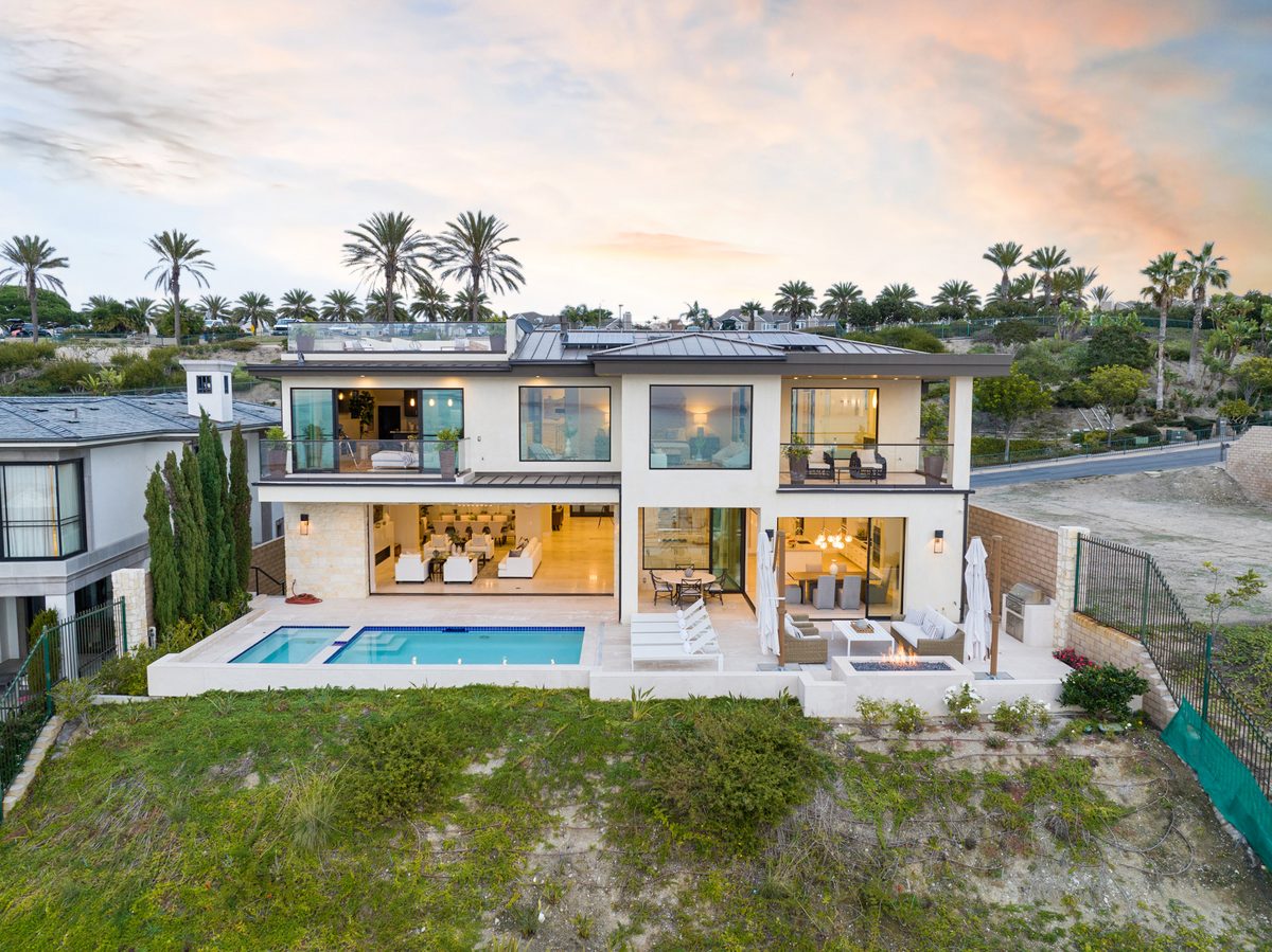 Drone aerial photo of an Orange County coastal home showing lot and ocean views